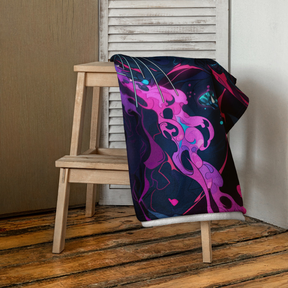 Colorful abstract design blanket draped over a wooden chair against a neutral wall.